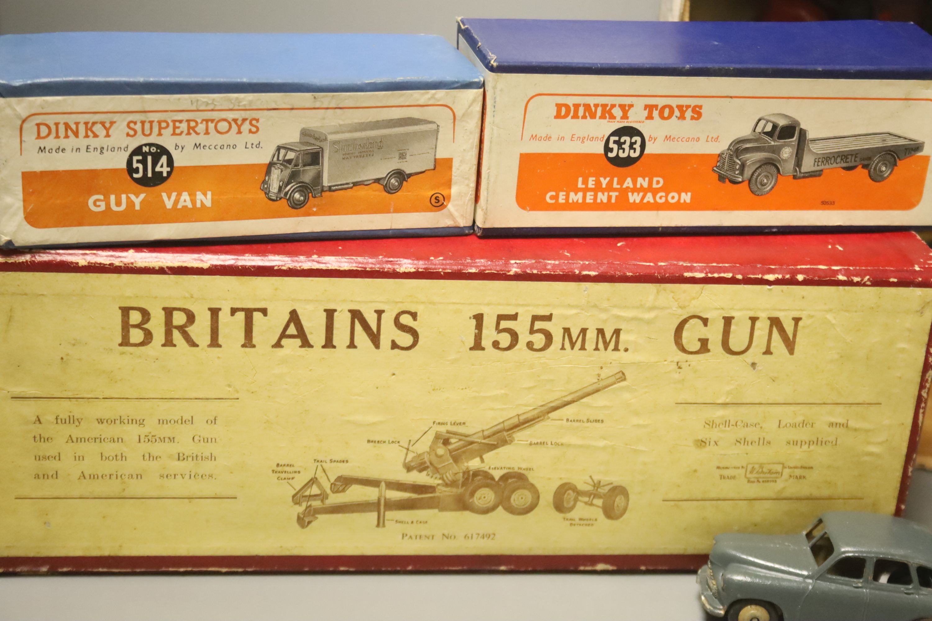 A boxed Britains 155MM gun, a Dinky Supertoys Guy Van 514 and Leyland Cement Wagon 533 and assorted diecast vehicles